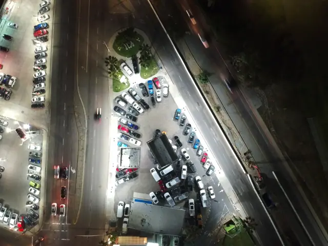 Aerial night view of the LED-lit sales lot at Mossy Ford in Pacific Beach