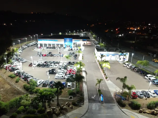 Aerial night view of the LED-lit dealership lot at Mossy Honda in Lemon Grove