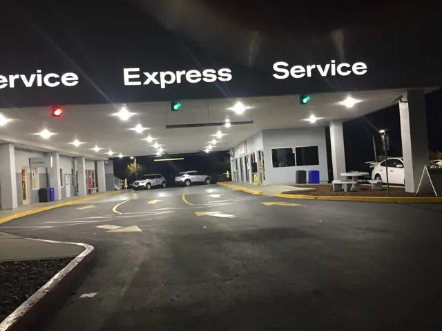 LED canopy lighting at the Express Service drive at Mossy Nissan Oceanside at night